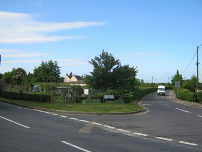a road with an allotment on the corner