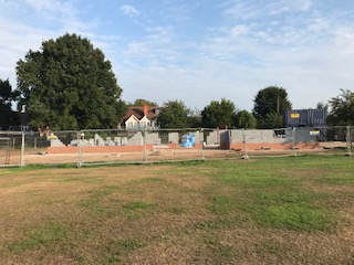 a build site behind a fence