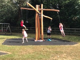 children playing on play equipment