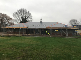 the pavilion with a grey roof on it